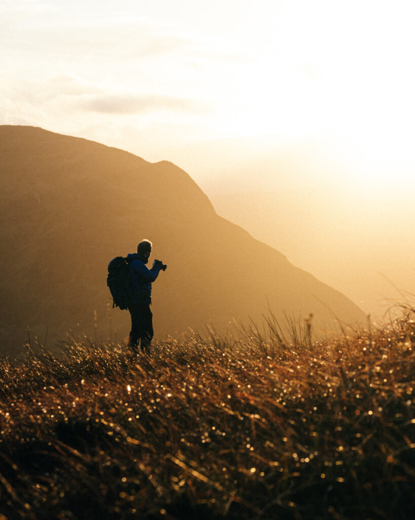 Photographer Benjamin Barendrecht on a Scottish mountain at Sunset