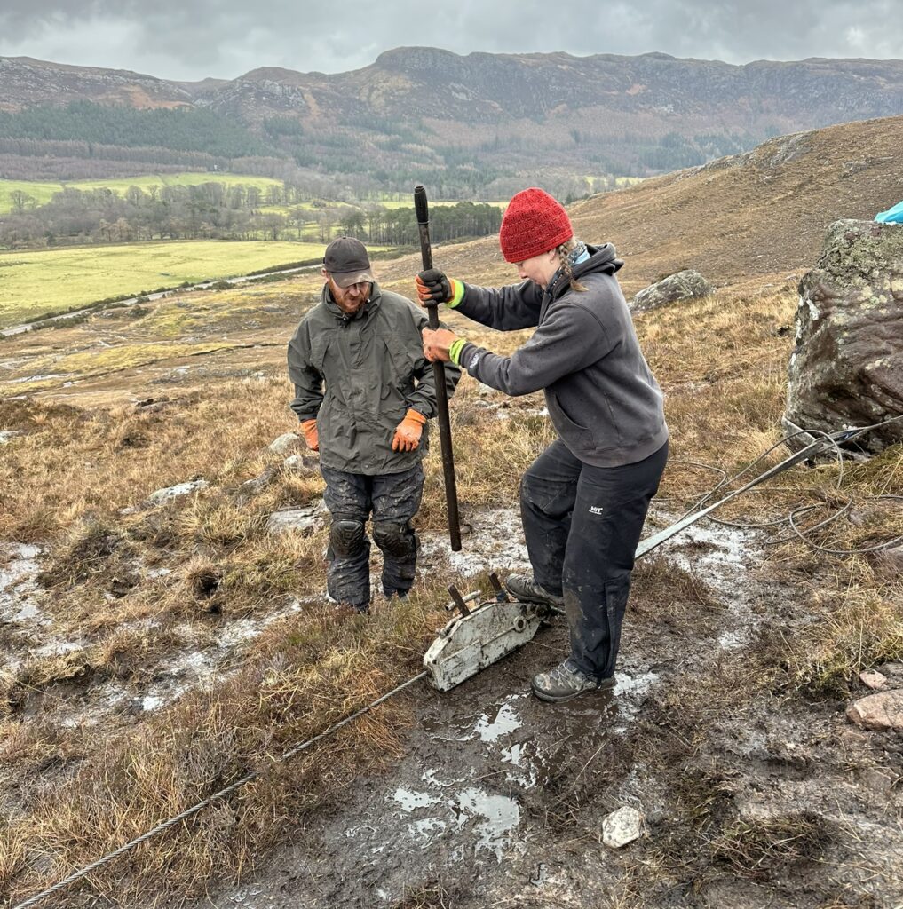 Volunteers at work repairing a mountain path